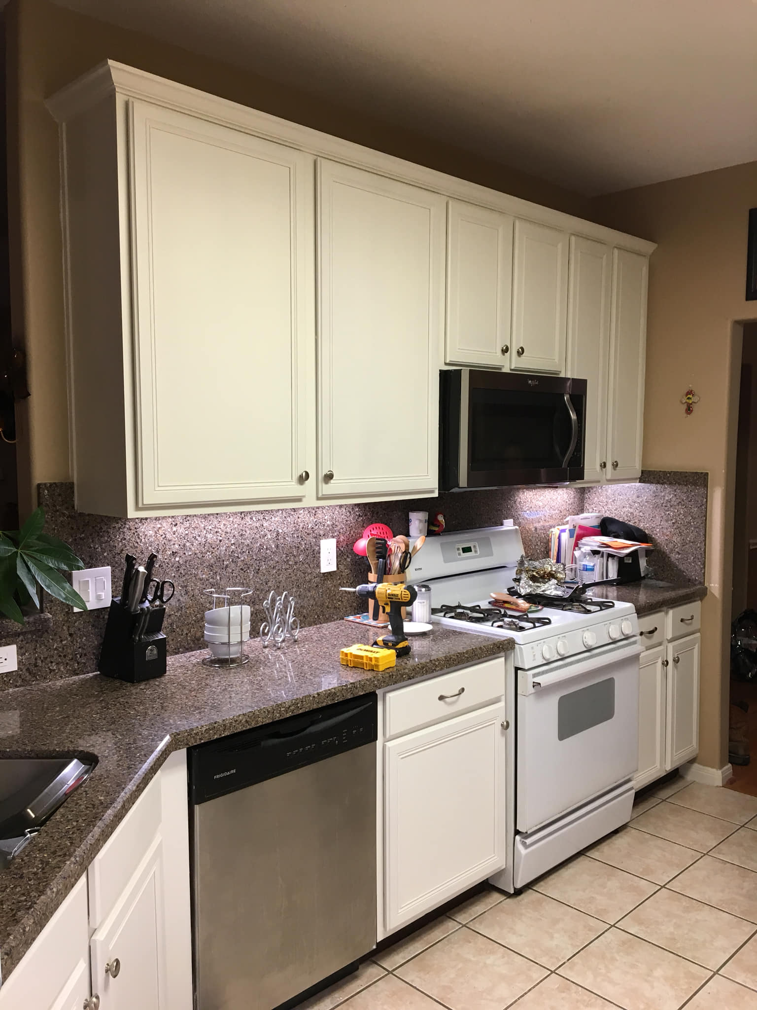 Kitchen with light cabinets, stainless steel appliances, and granite countertops.