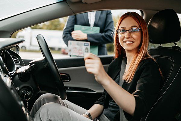 Lady Showing Her Driver's License — Bob Shropshire Driving School — Cincinnati, OH