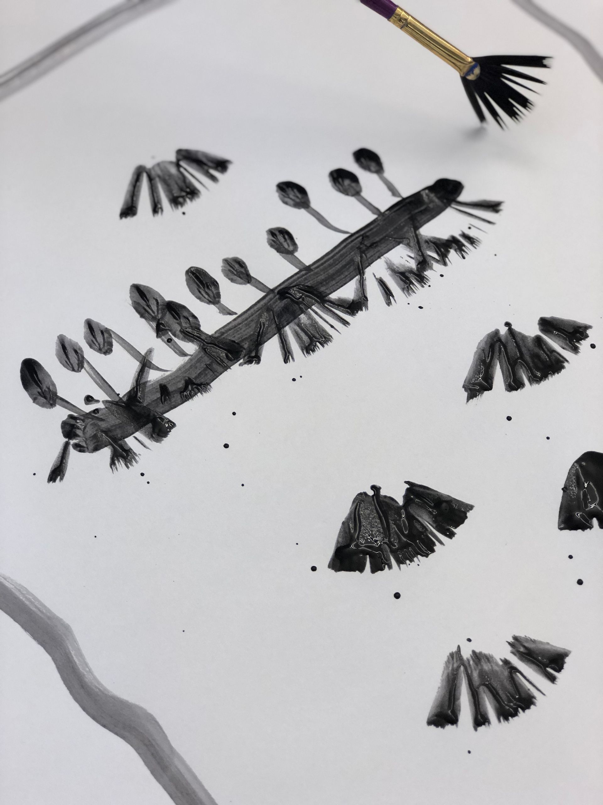 A black and white drawing of spoons on a white surface