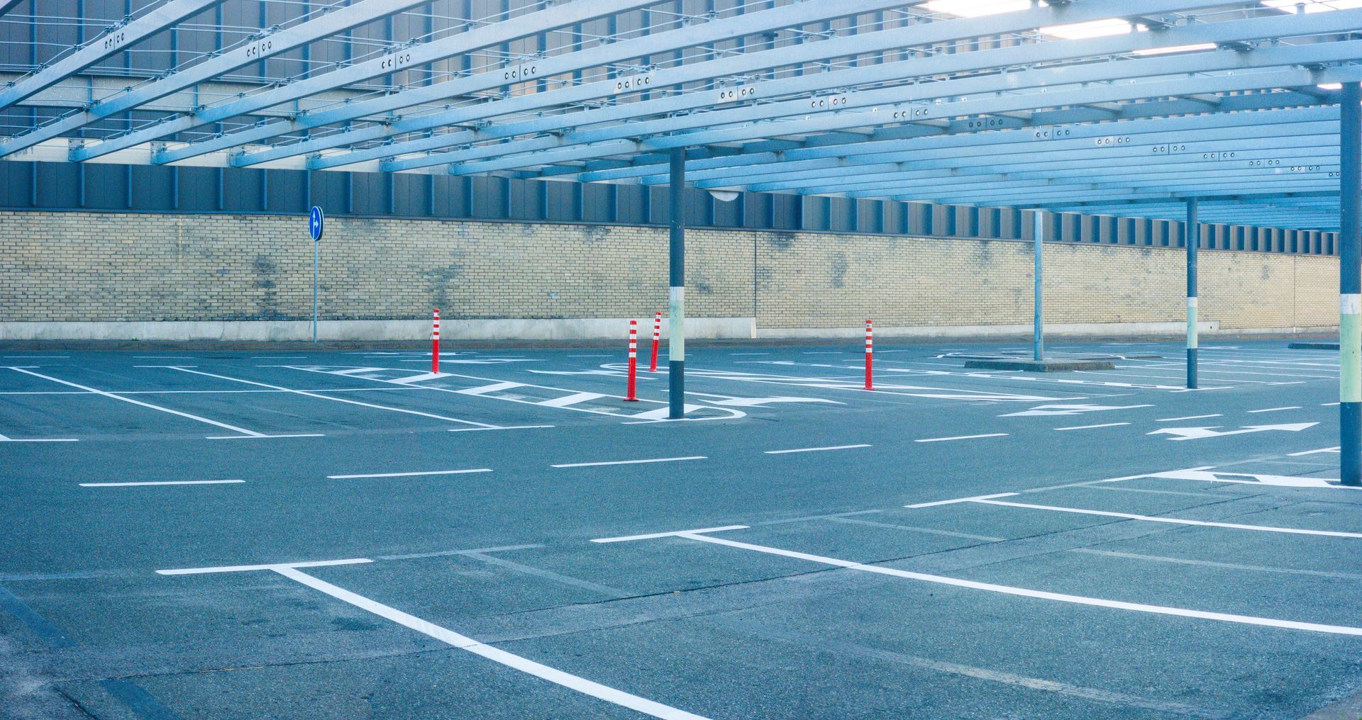 Lined parking space representing expert services from a reliable parking lot paving contractor. Lined parking space representing expert services from a reliable parking lot paving contractor.