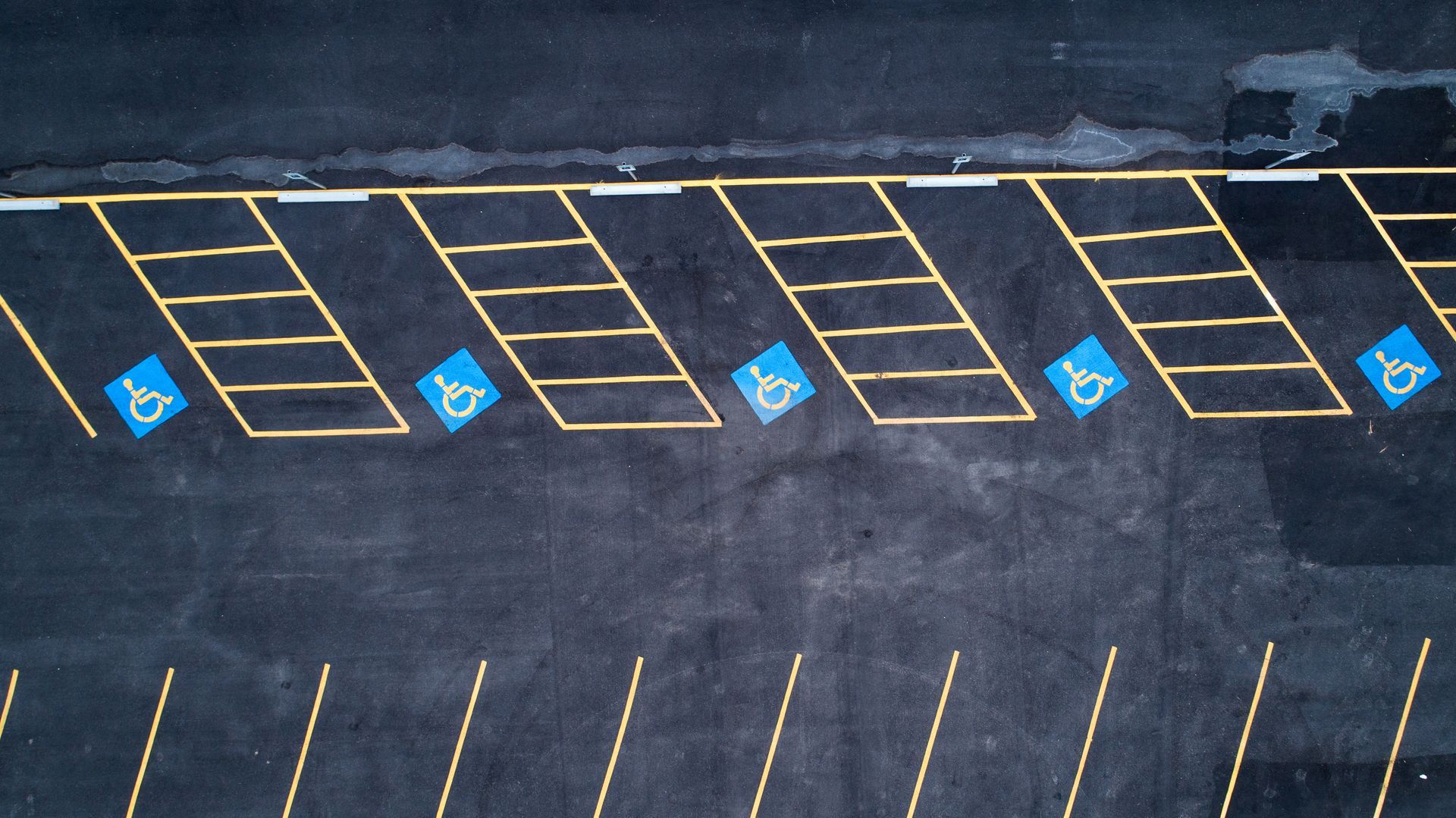 Parking area showcasing professional road markings by a trusted parking lot paving contractor.