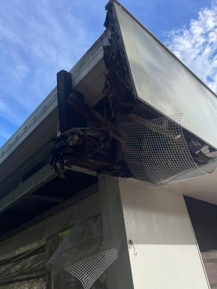 Damaged Roof Corner With Charred Wood — RAC Carpentry Services in Pimpama, QLD