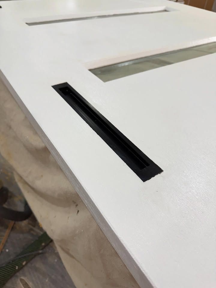 White Door With Rectangular Black Vent — RAC Carpentry Services in Pimpama, QLD
