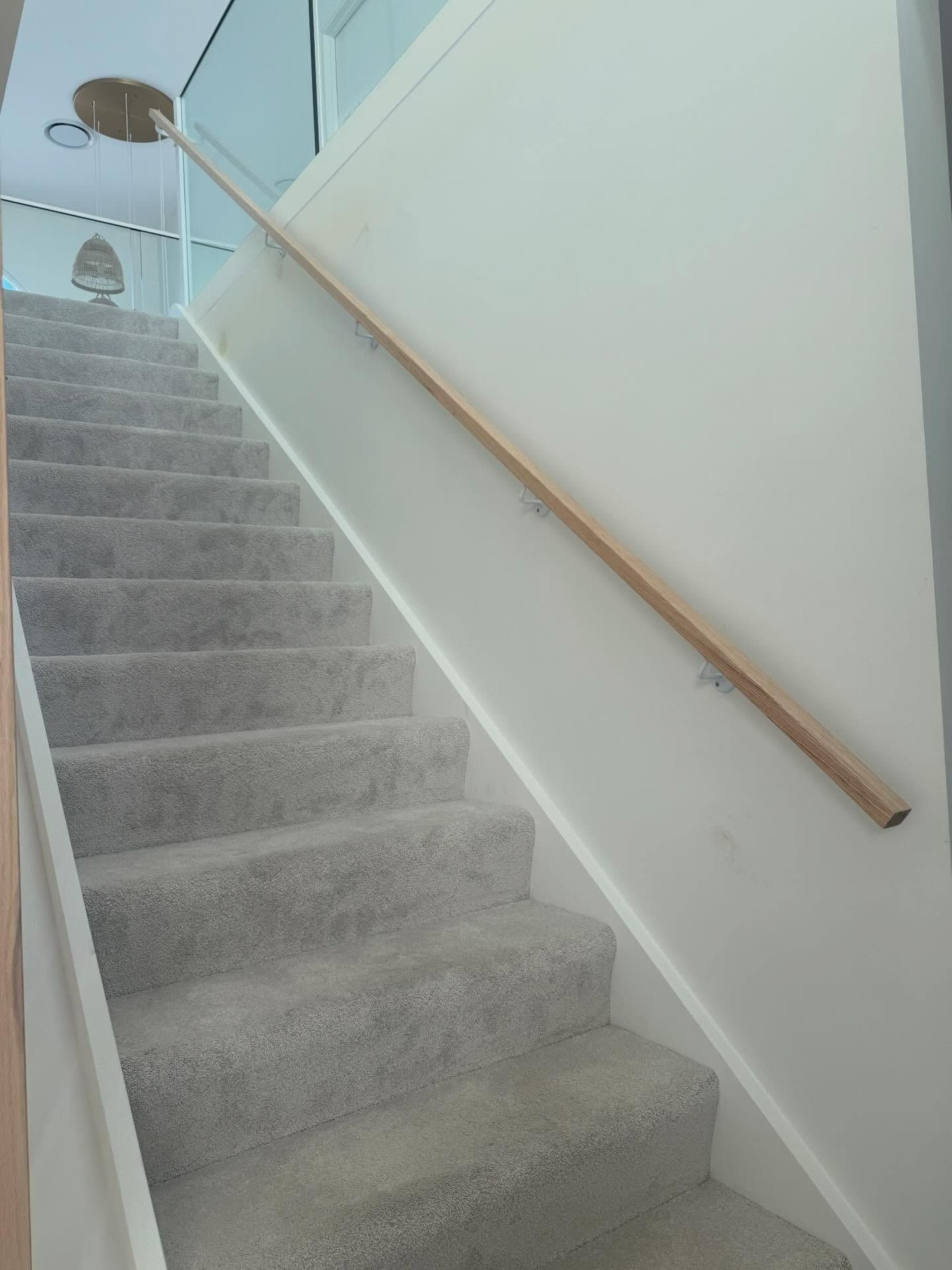 Staircase With Gray Carpeted Steps — RAC Carpentry Services in Pimpama, QLD