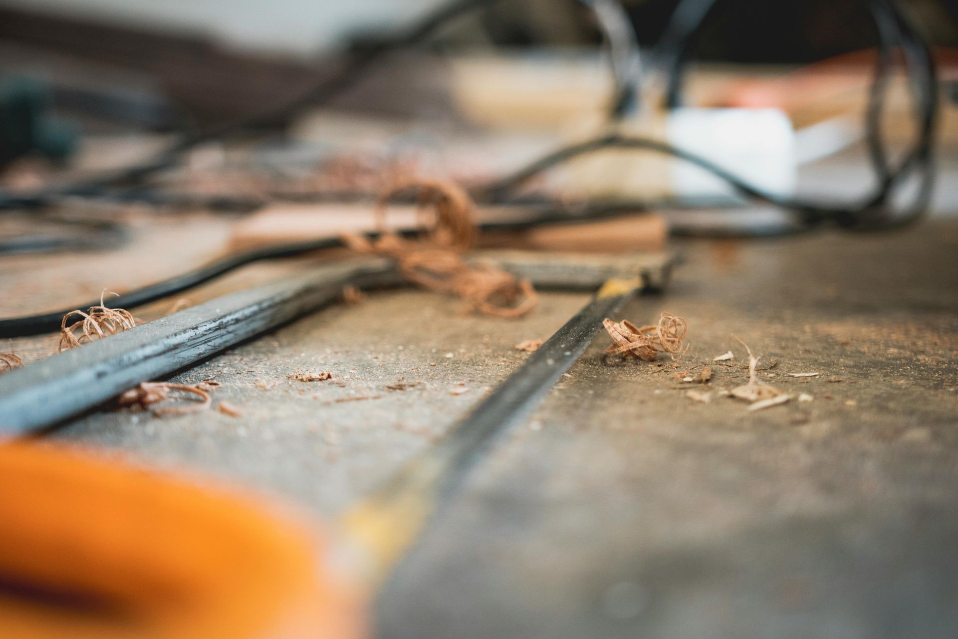 A Hacksaw Rests on a Workshop Surface — RAC Carpentry Services in Pimpama, QLD