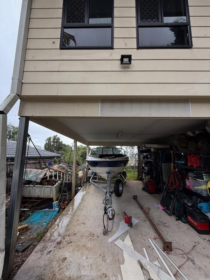 Boat on Trailer Under a House — RAC Carpentry Services in Helensvale, QLD