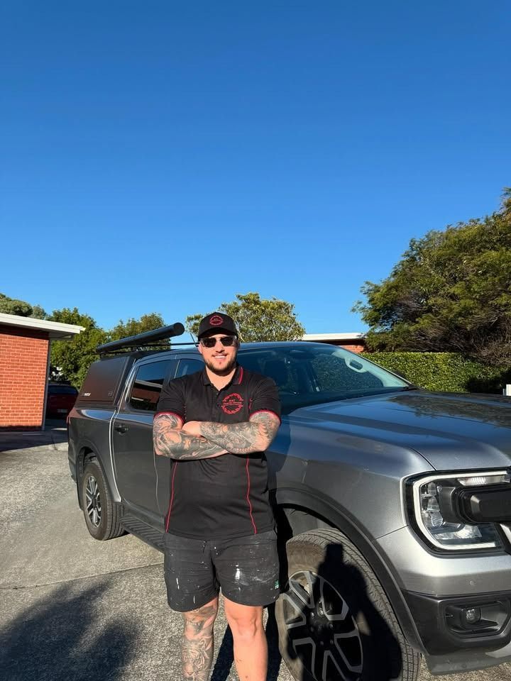 Man in Work Clothes Stands — RAC Carpentry Services in Pimpama, QLD