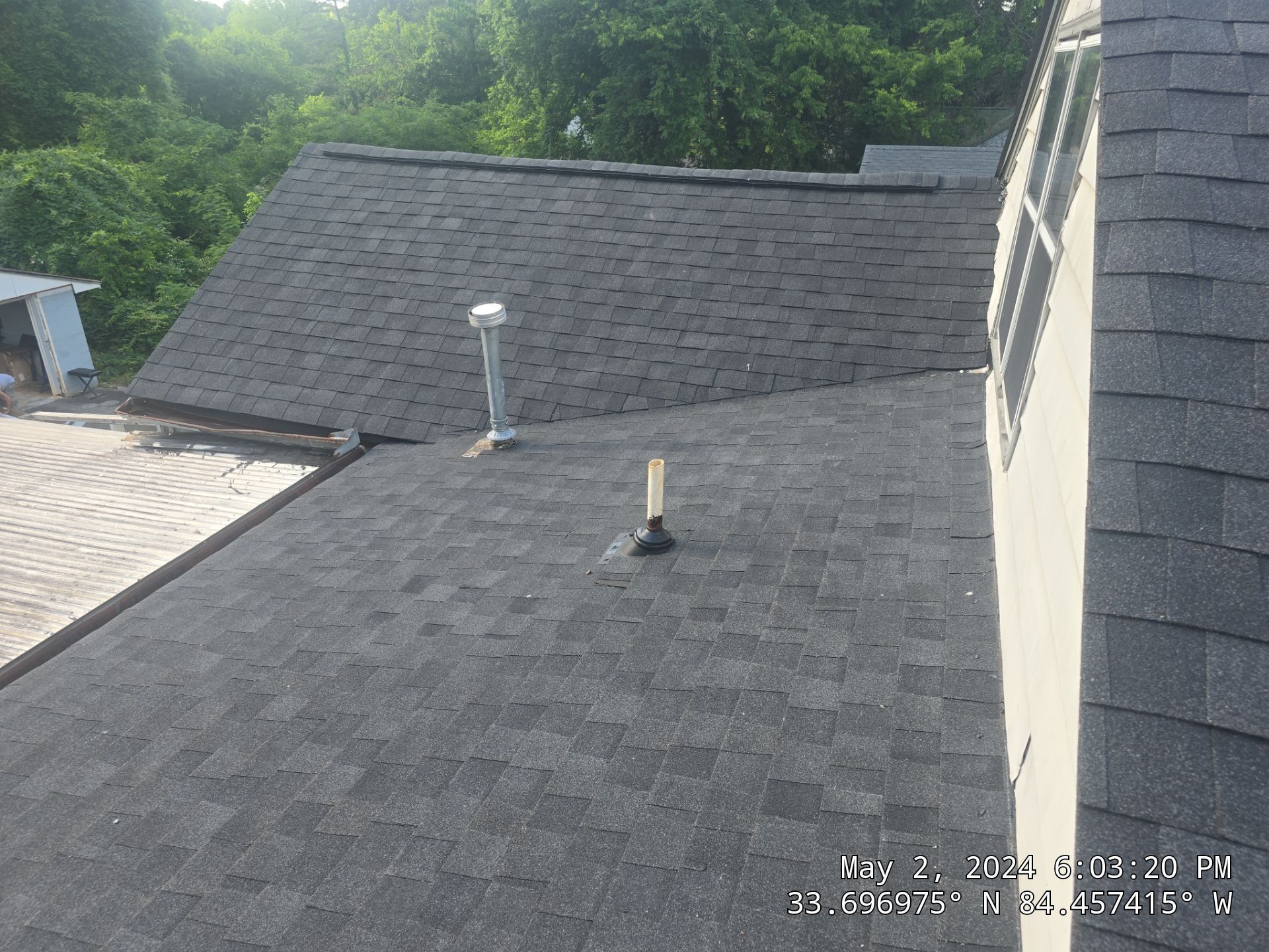 A house with a car parked in front of it