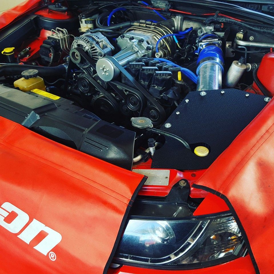 A Red Car With A Hood Cover That Says Snap On — Mr Shiny Mechanical in Andergrove, QLD