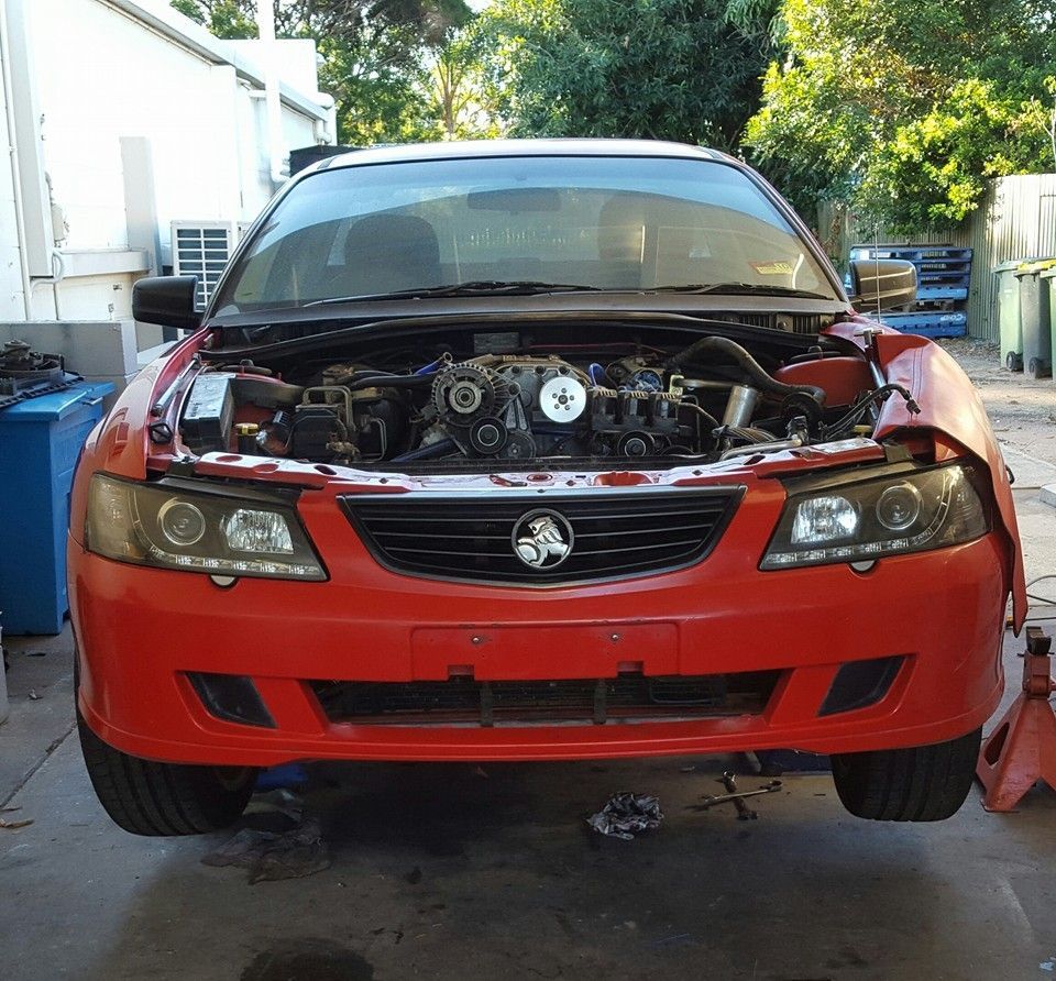 A Red Car With the Hood Open and the Engine Visible — Mr Shiny Mechanical in Northern Beaches, QLD