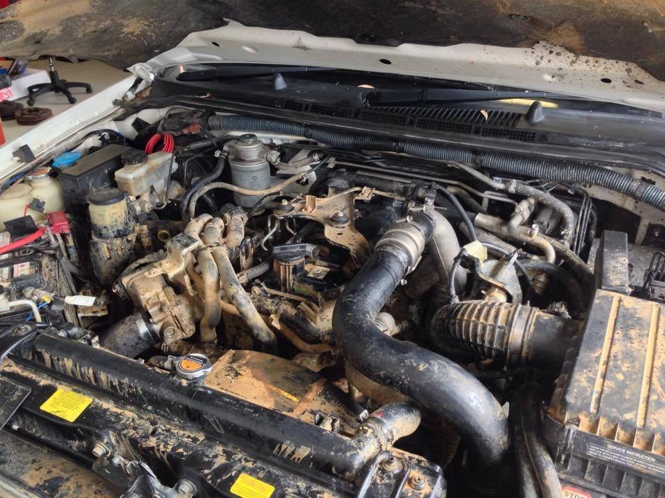 The Engine of a White Car is Covered in Dirt — Mr Shiny Mechanical in Marian, QLD