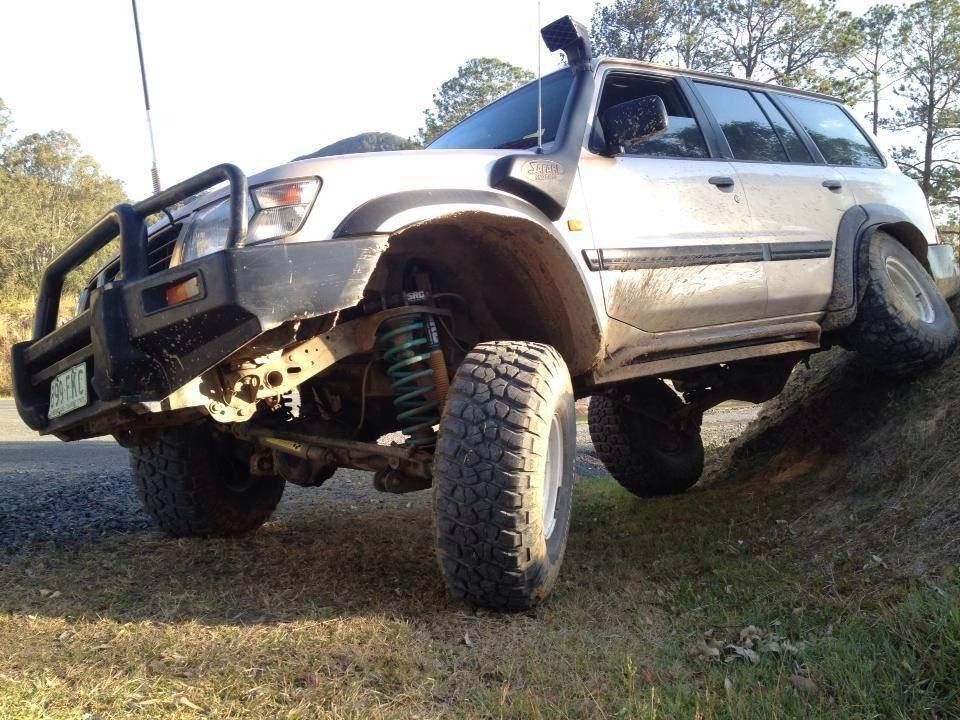 A Silver Suv is Parked on a Grassy Hillside — Mr Shiny Mechanical in Northern Beaches, QLD