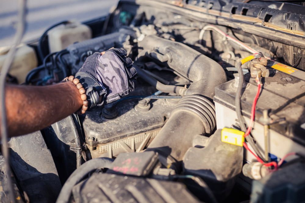 A Man is Working on the Engine of a Car — Mr Shiny Mechanical in Marian, QLD
