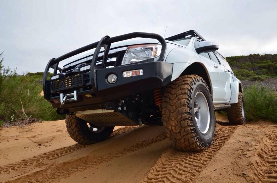 A White Truck is Driving Down a Dirt Road β Mr Shiny Mechanical in Andergrove, QLD