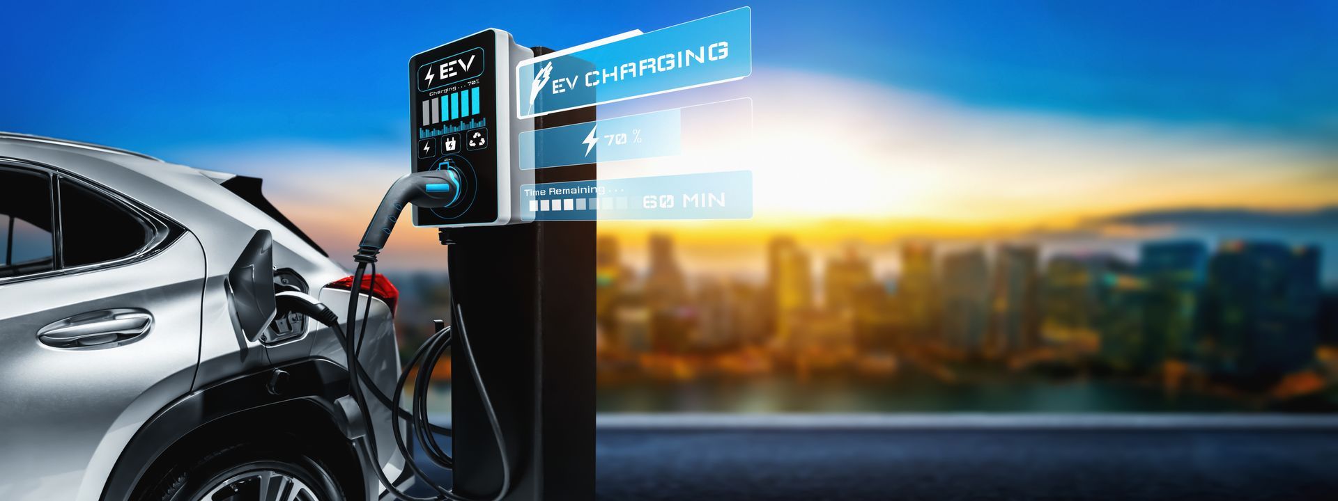 An electric car charging station with a car and city skyline at sunset.