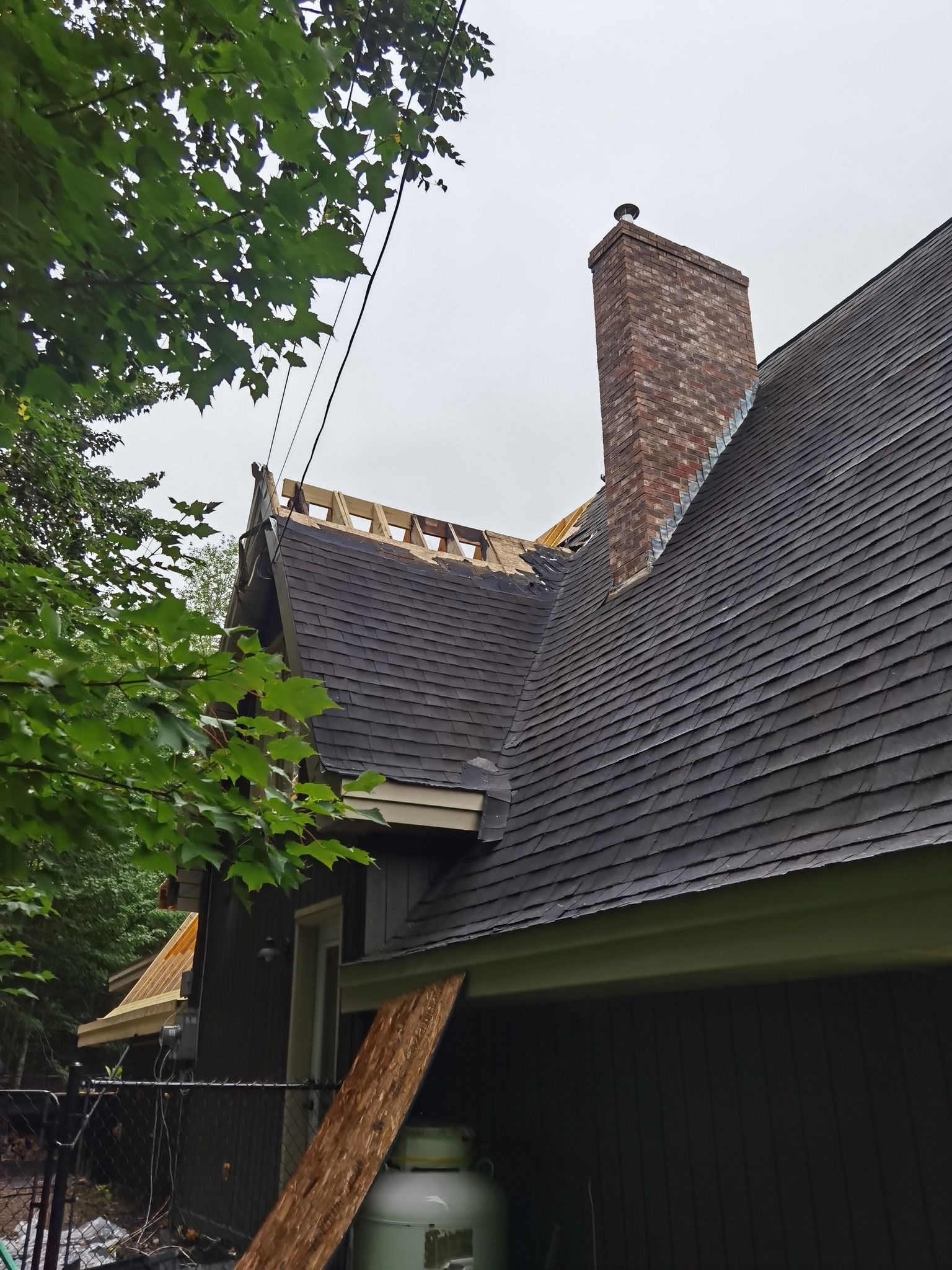 A roof of a house with a chimney on top of it