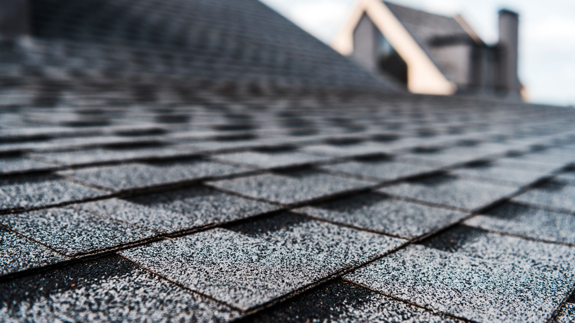 A close up of a roof with shingles on it.