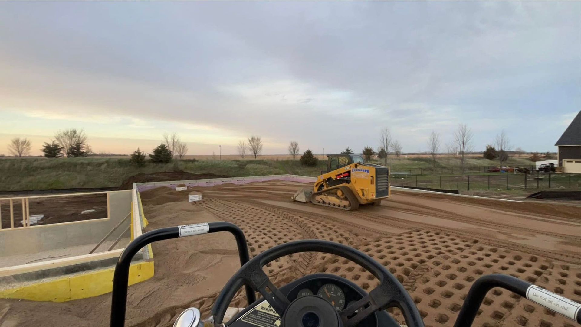 A bulldozer is moving dirt on a construction site.