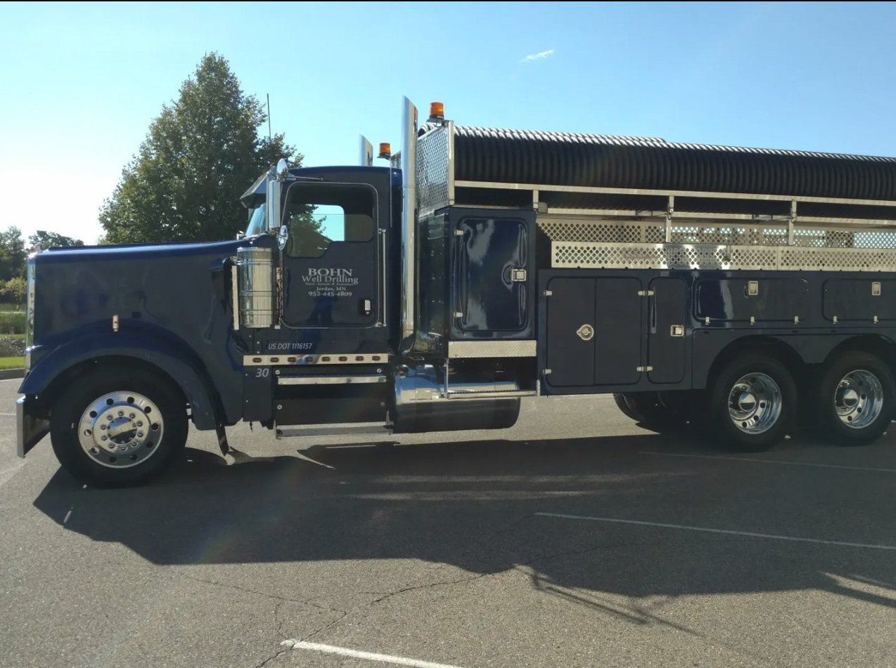 A Bohn truck is parked on the side of the road
