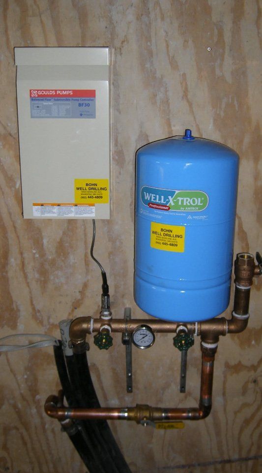A blue water tank with mill-xtrol written on it