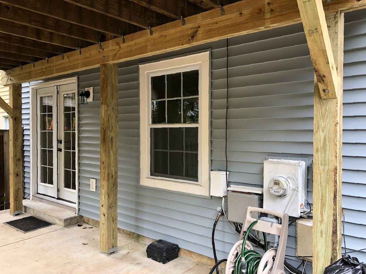 A house with a covered porch and a window.