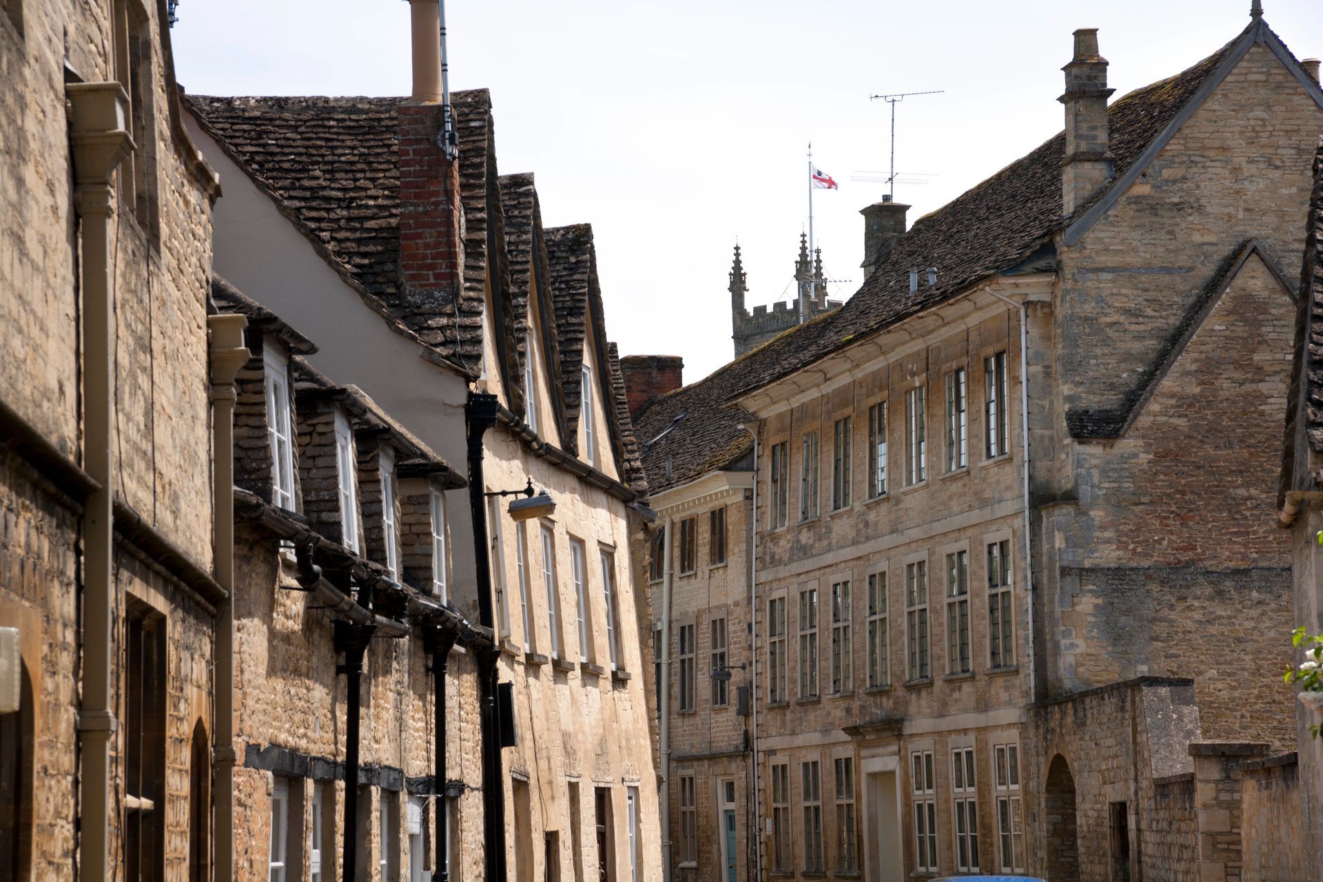Quaint historic 17th century buildings line the street in Cirencester, The Cotswold's, England, United Kingdom. Note the guttering configurations.