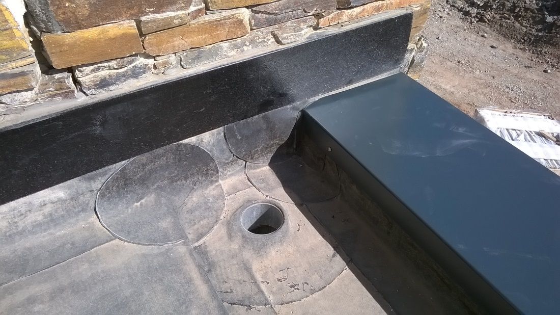 a flat roof valley gutter lining using the plygene gutter lining system.