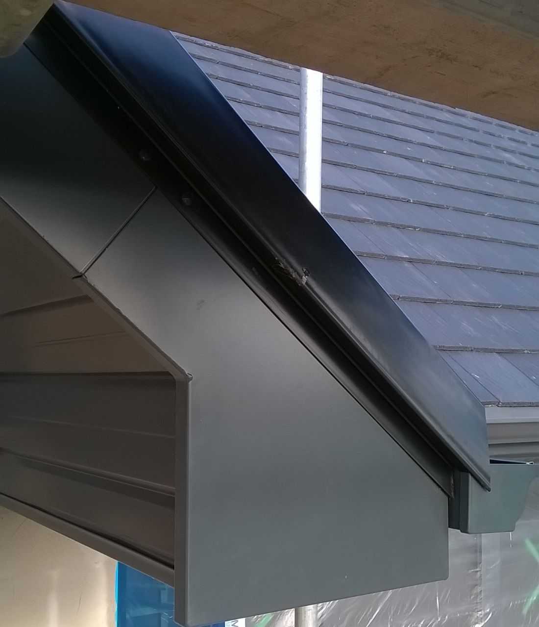 an image of black aluminium gutter system and soffits and fascia on a modern architect designed house.