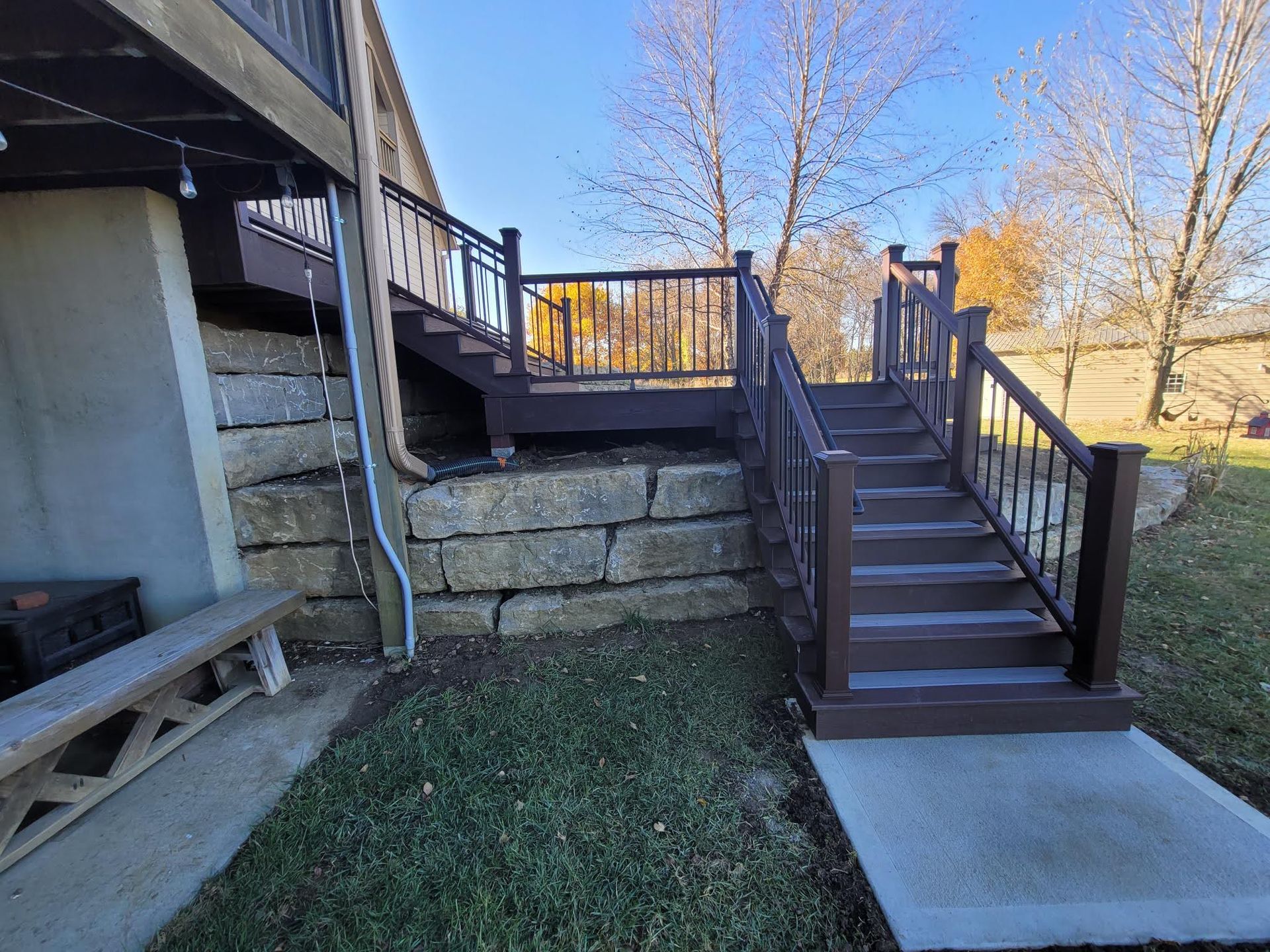 A wooden deck with stairs leading up to it.