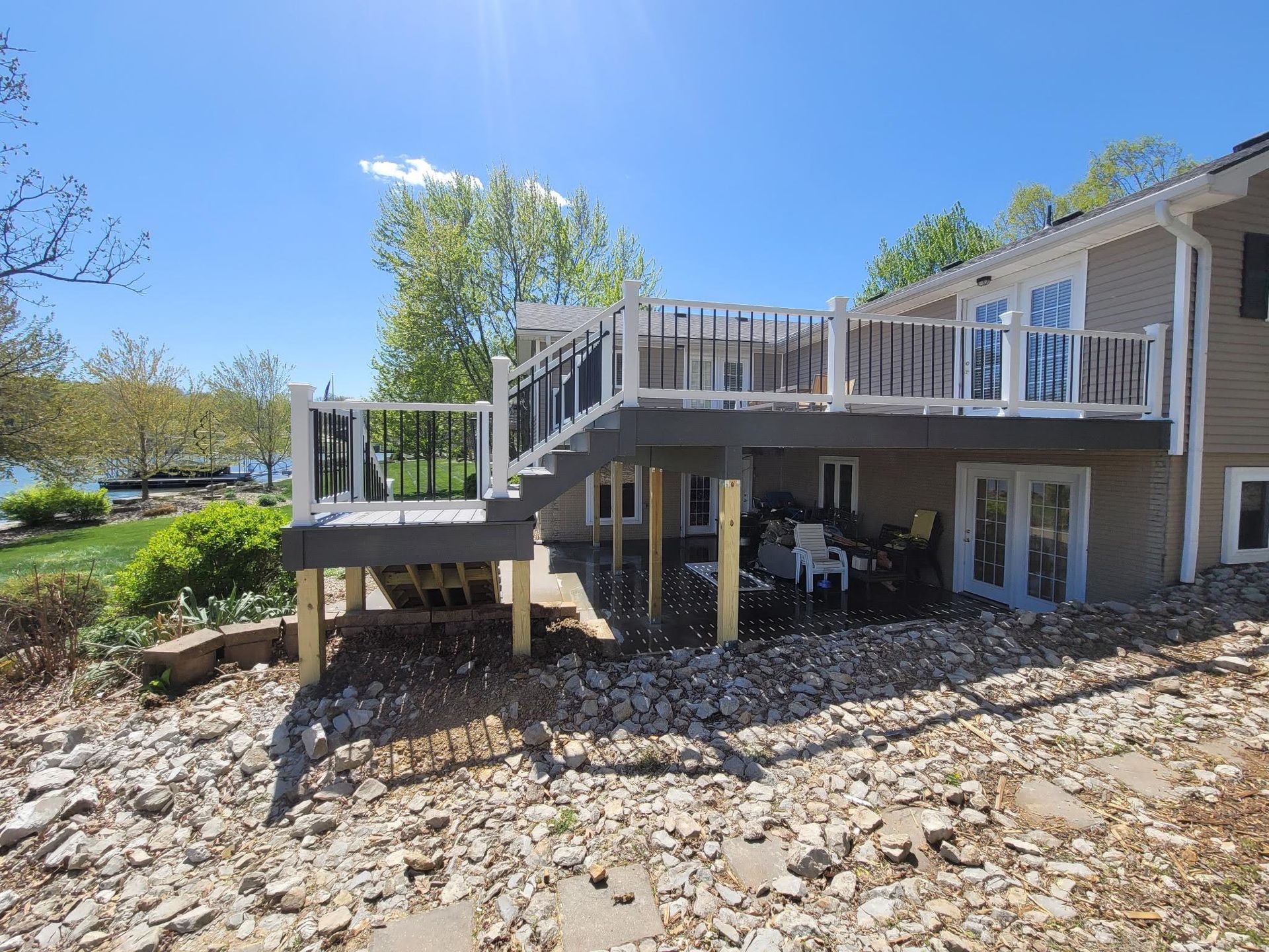 A large house with a large deck and stairs