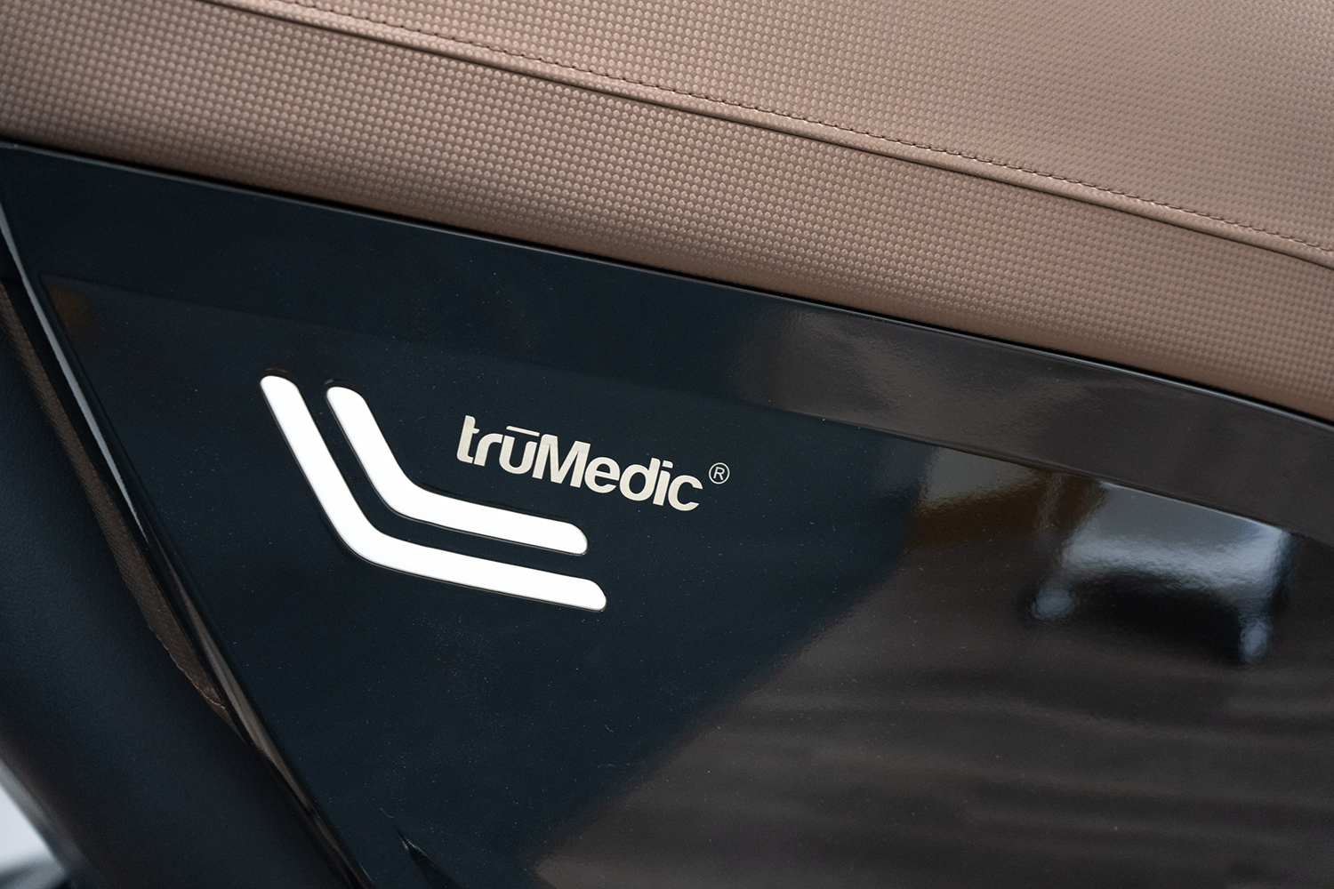 A close up of a trumedic logo on the side of a chair