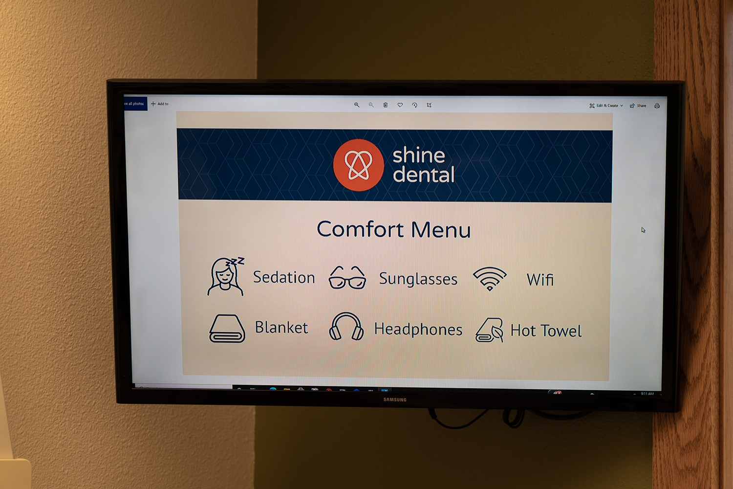 A shine dental comfort menu is displayed on a flat screen tv