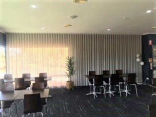 Open Wavefold Curtains In A Corporate Room — Blinds, Curtains And Shutters In Alice Springs, NT