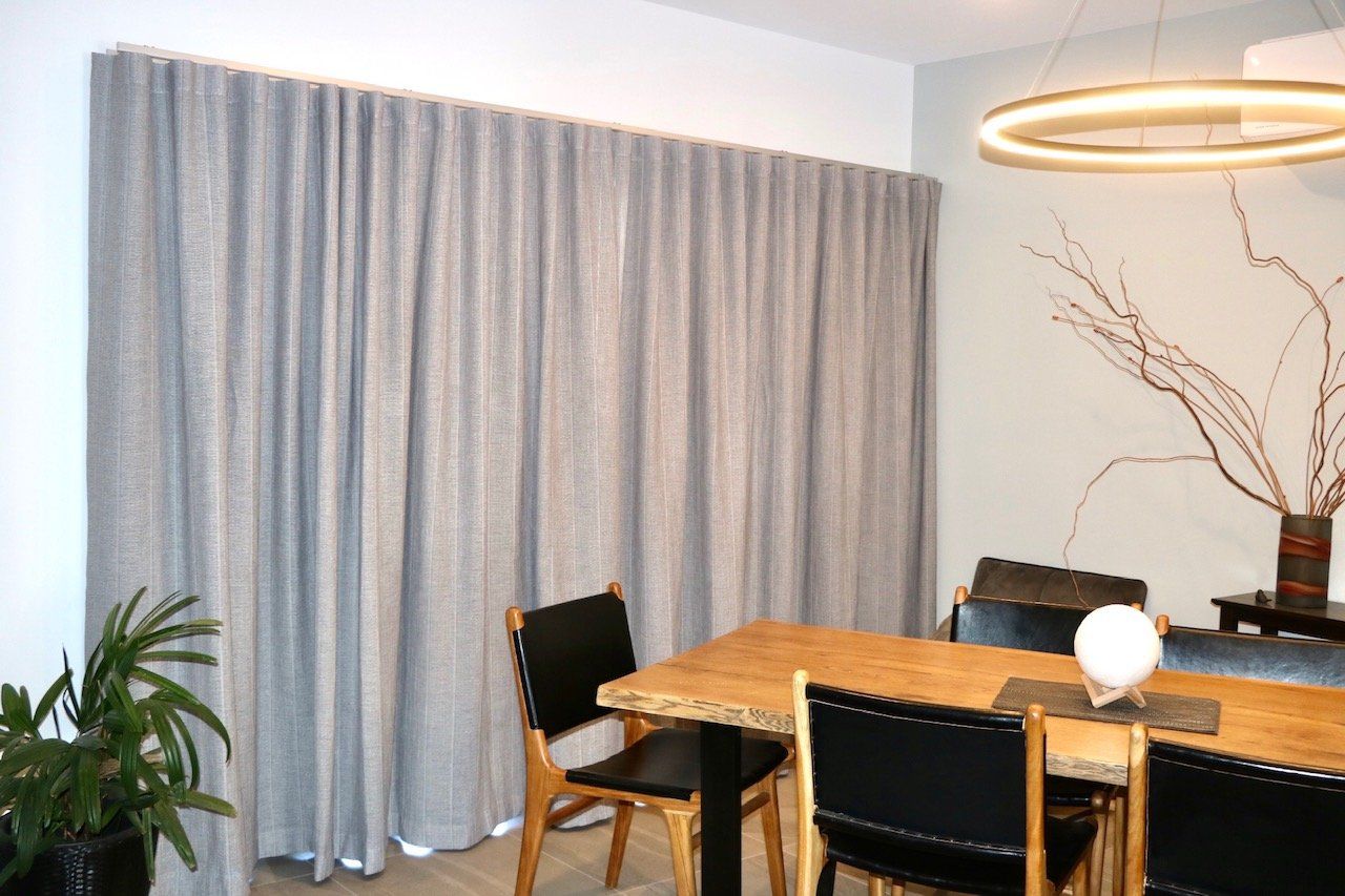 Internal Wavefold Curtains Behind A Table — Blinds, Curtains And Shutters In Alice Springs, NT