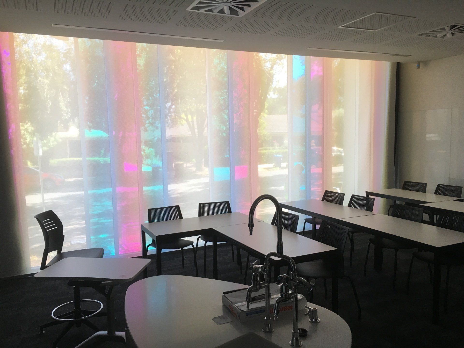 White Roller Shade Behind Student's Desks — Blinds, Curtains And Shutters In Alice Springs, NT