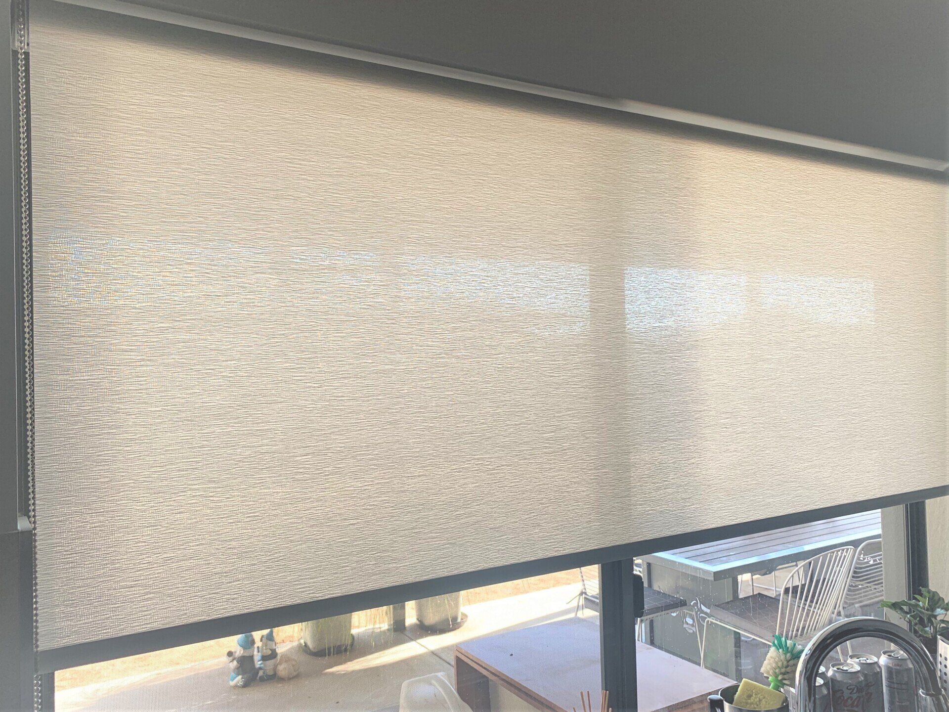 Roller Blind Blocking Out The Sun — Blinds, Curtains And Shutters In Alice Springs, NT