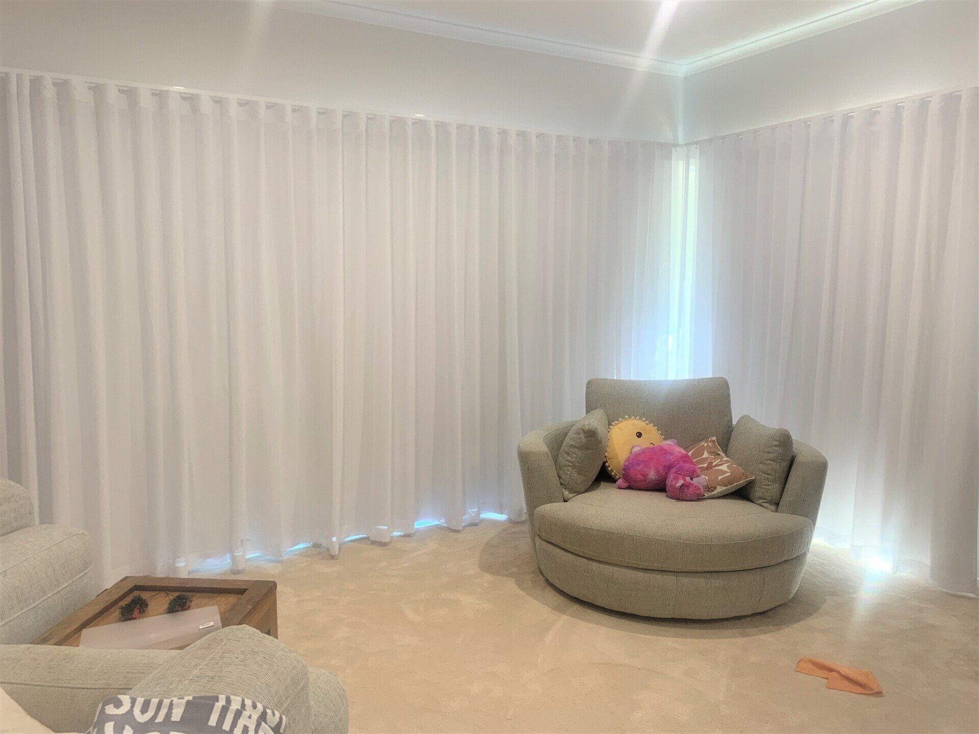 Closed Curtains Behind An Armchair — Blinds, Curtains And Shutters In Alice Springs, NT