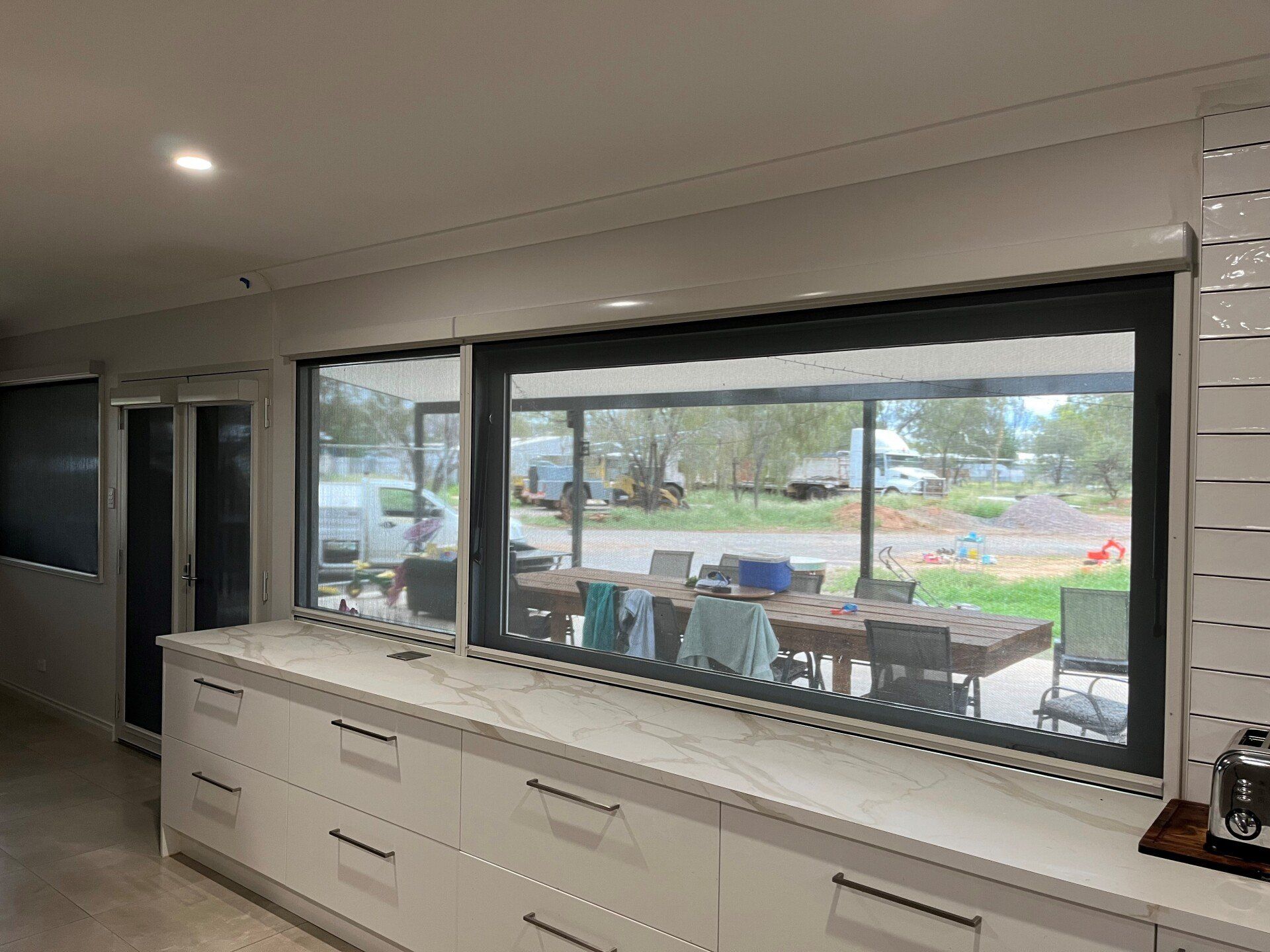 Long Roller Shades Over Kitchen Bench — Blinds, Curtains And Shutters In Alice Springs, NT