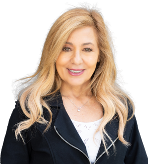 A woman with blonde hair is wearing a black jacket and a white shirt.