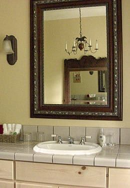 A bathroom with a sink and a large mirror