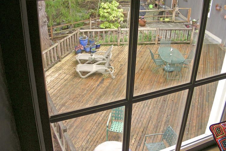 A view of a wooden deck through a window