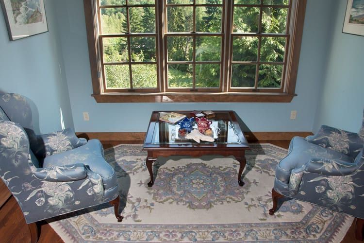 A living room with two chairs and a coffee table