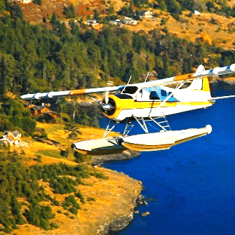 A yellow and white plane is flying over a body of water