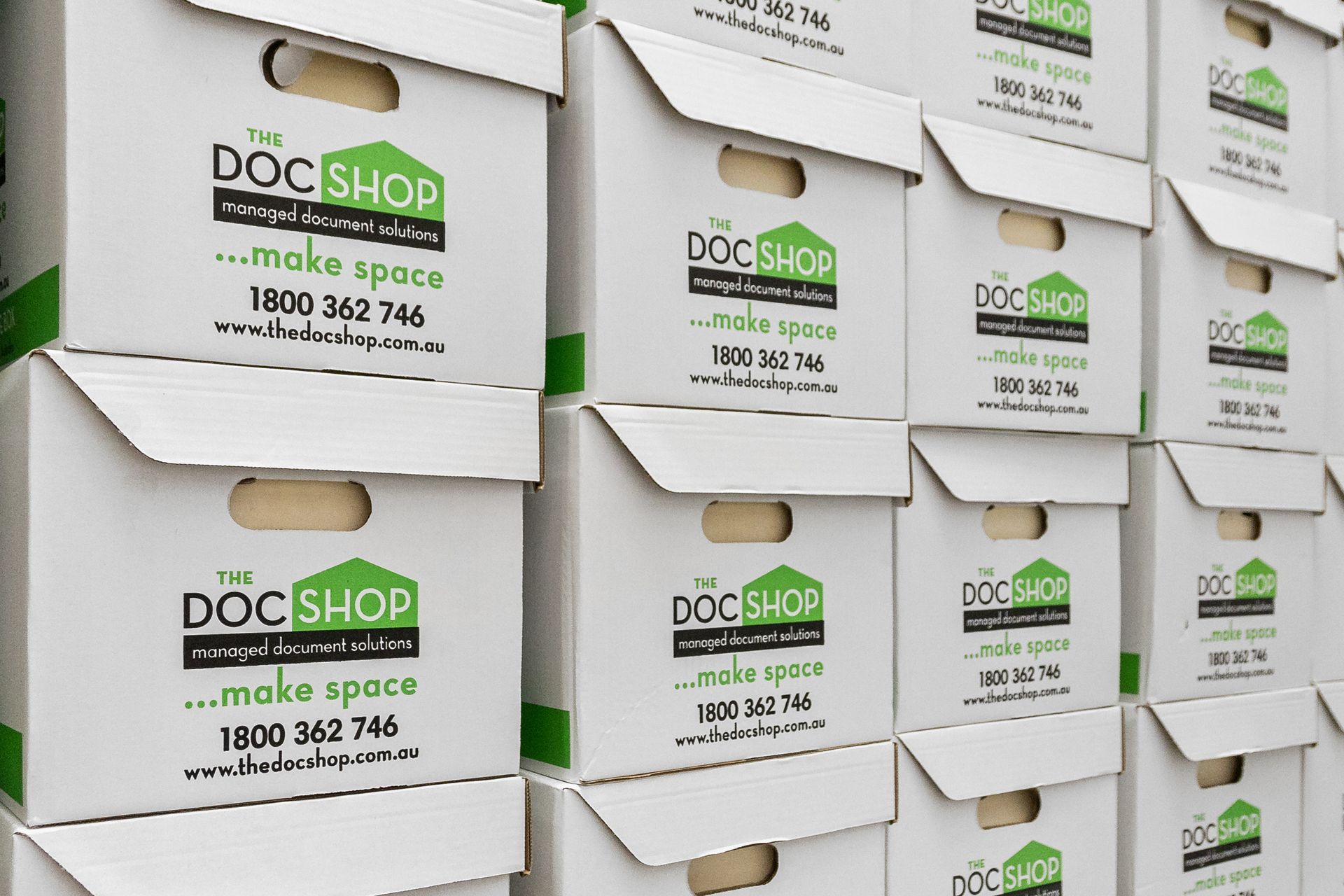 A long hallway filled with lots of shelves and boxes