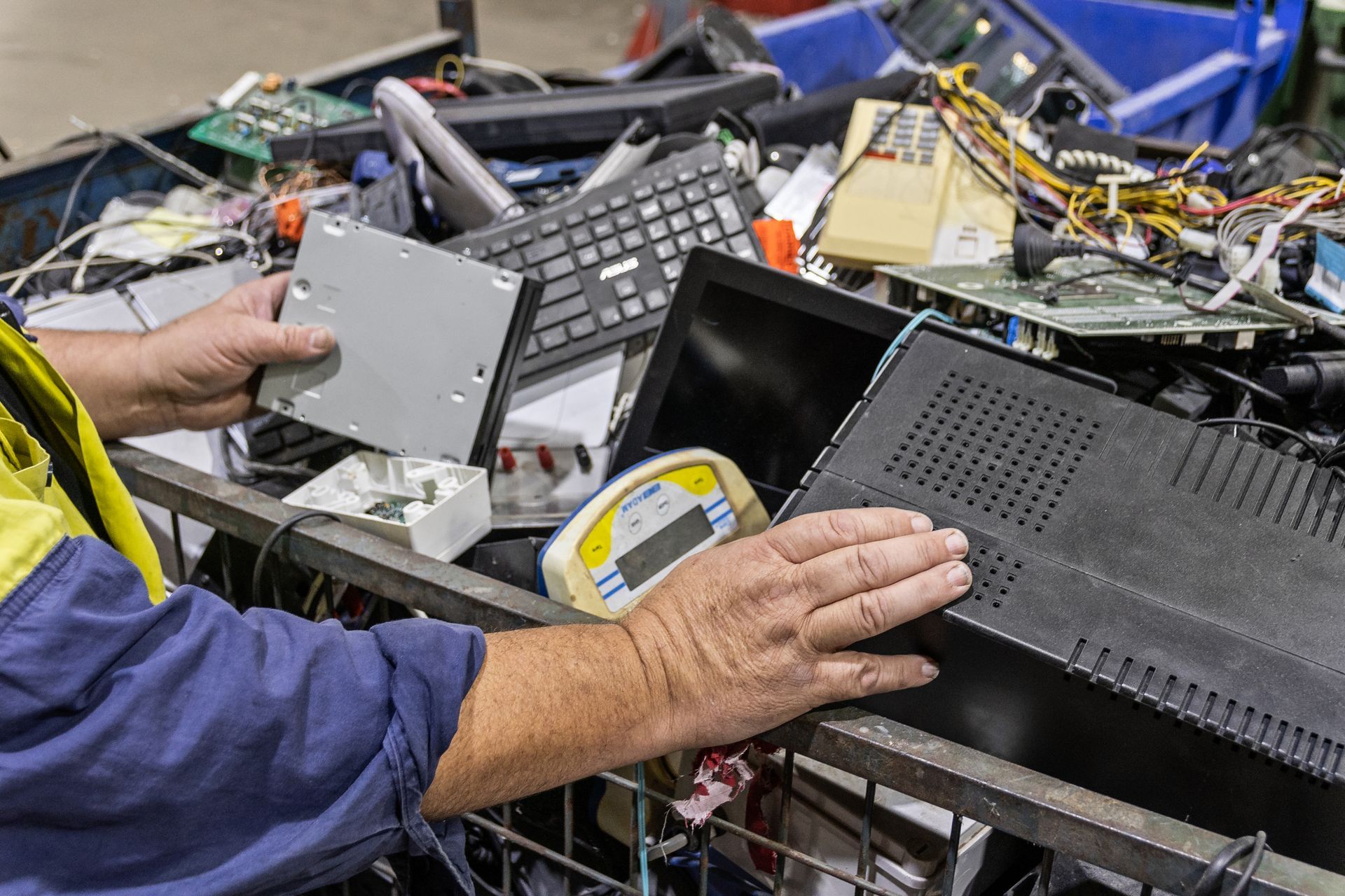 A person is shredding a piece of paper in a shredder