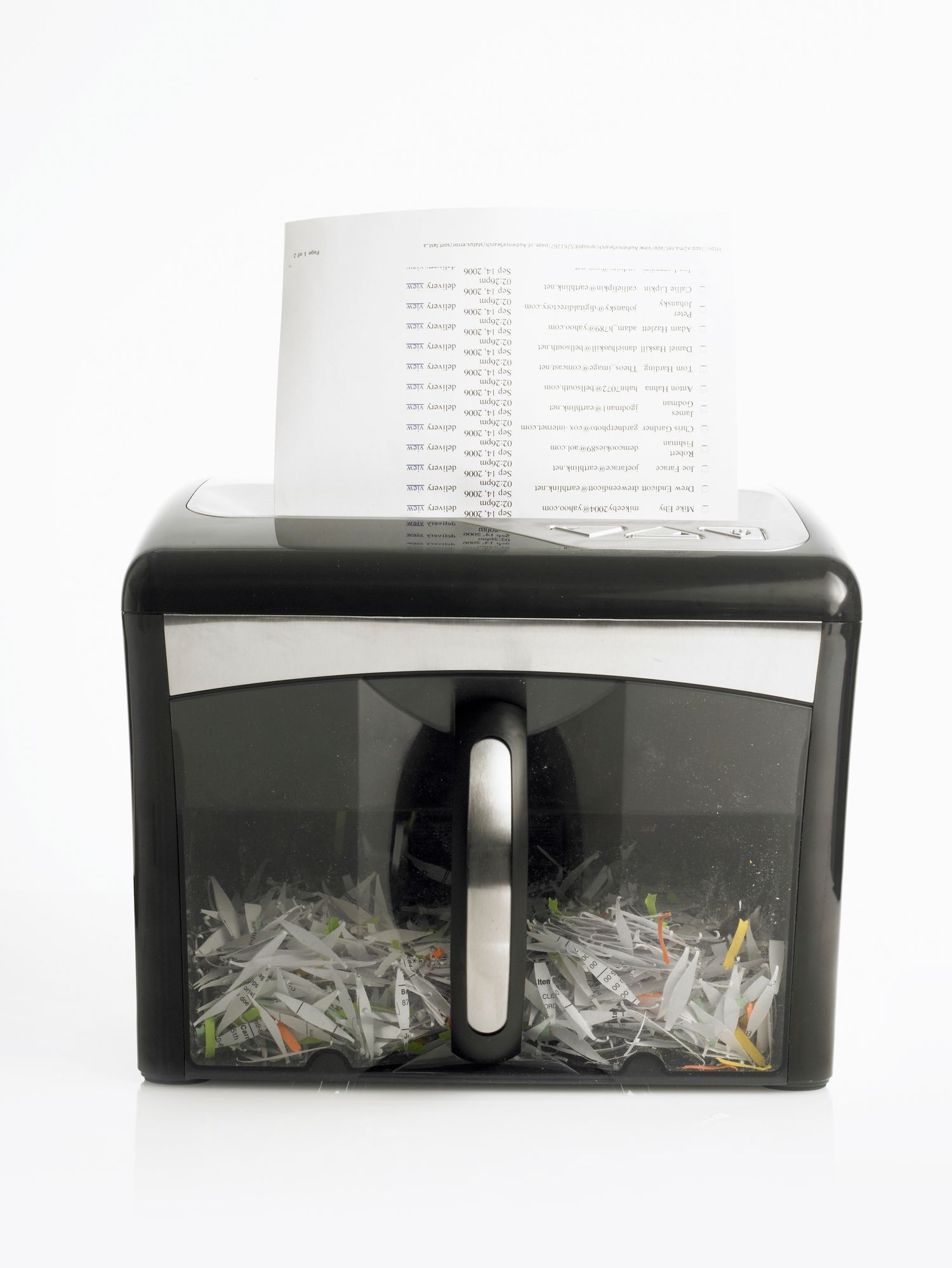 A paper shredder with a piece of paper sticking out of it.