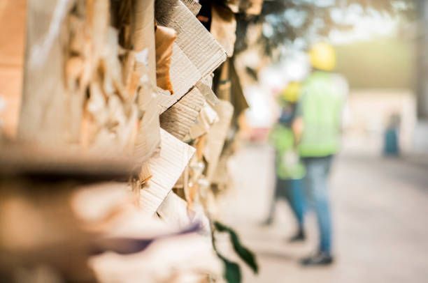 A blurry picture of a person standing next to a tree.