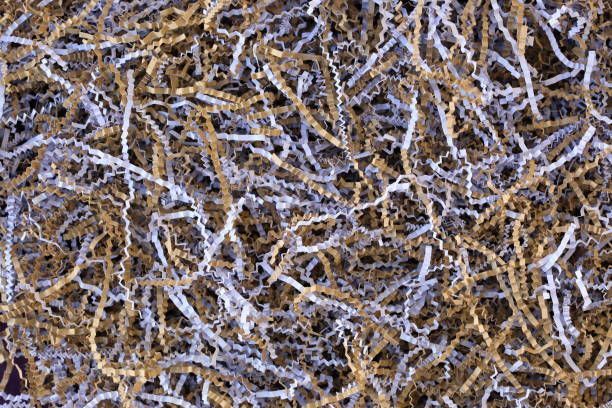 A close up of a pile of shredded paper under a microscope.