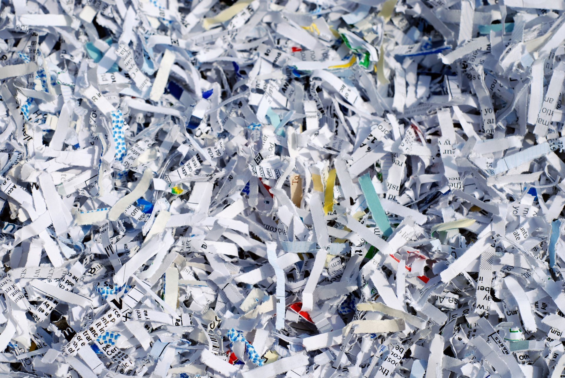 A pile of shredded paper is sitting on a table.