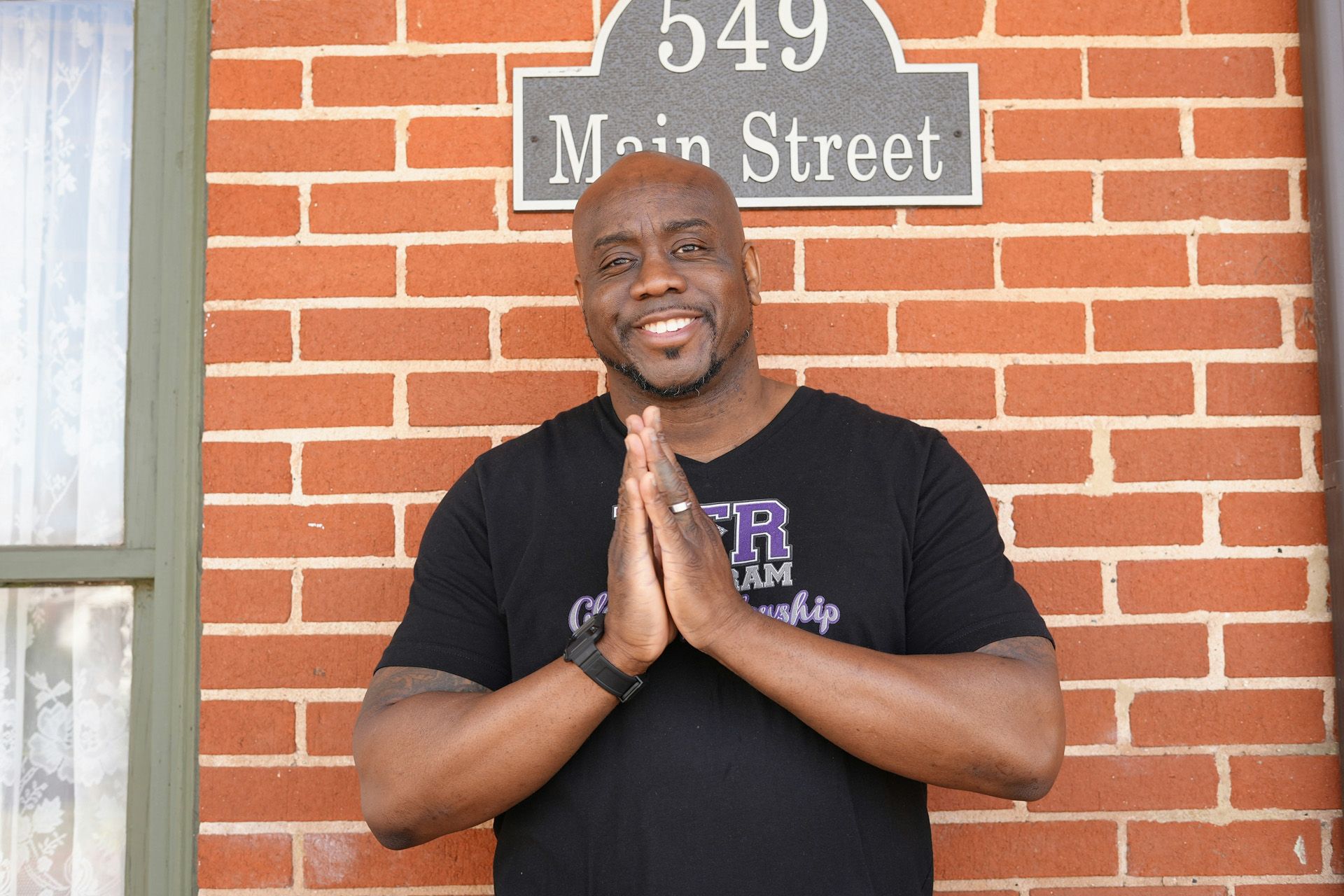 A person is standing in front of a pile of food.